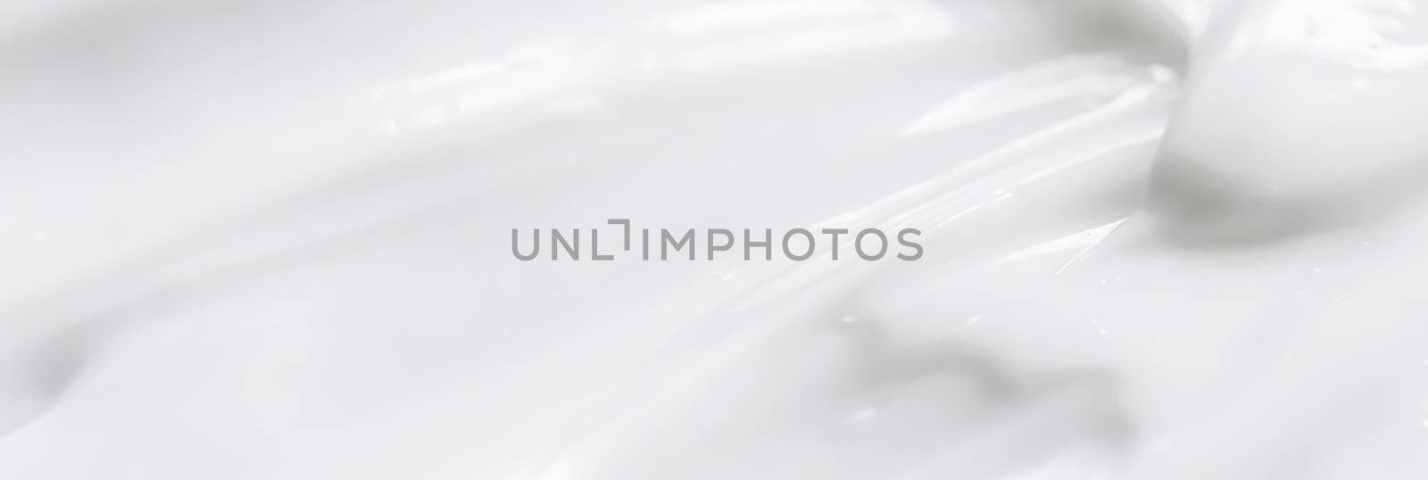 Pure white cream texture as abstract background, food substance or organic cosmetics