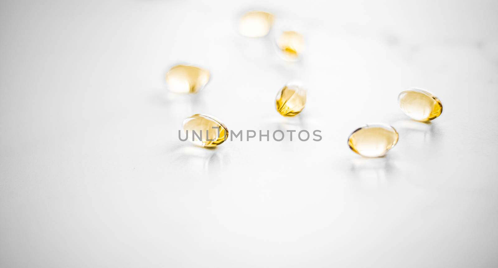 Vitamin D and golden Omega 3 pills for healthy diet nutrition, f by Anneleven