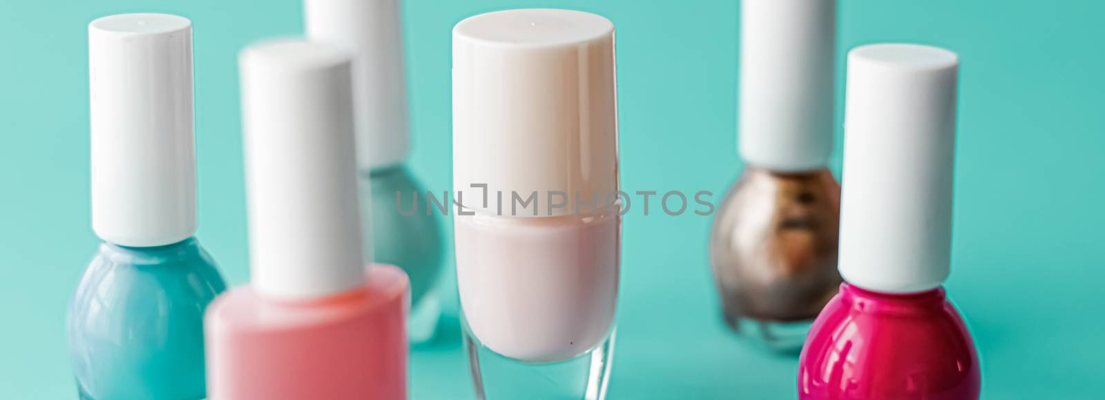 Nail polish bottles on green background, beauty brand by Anneleven