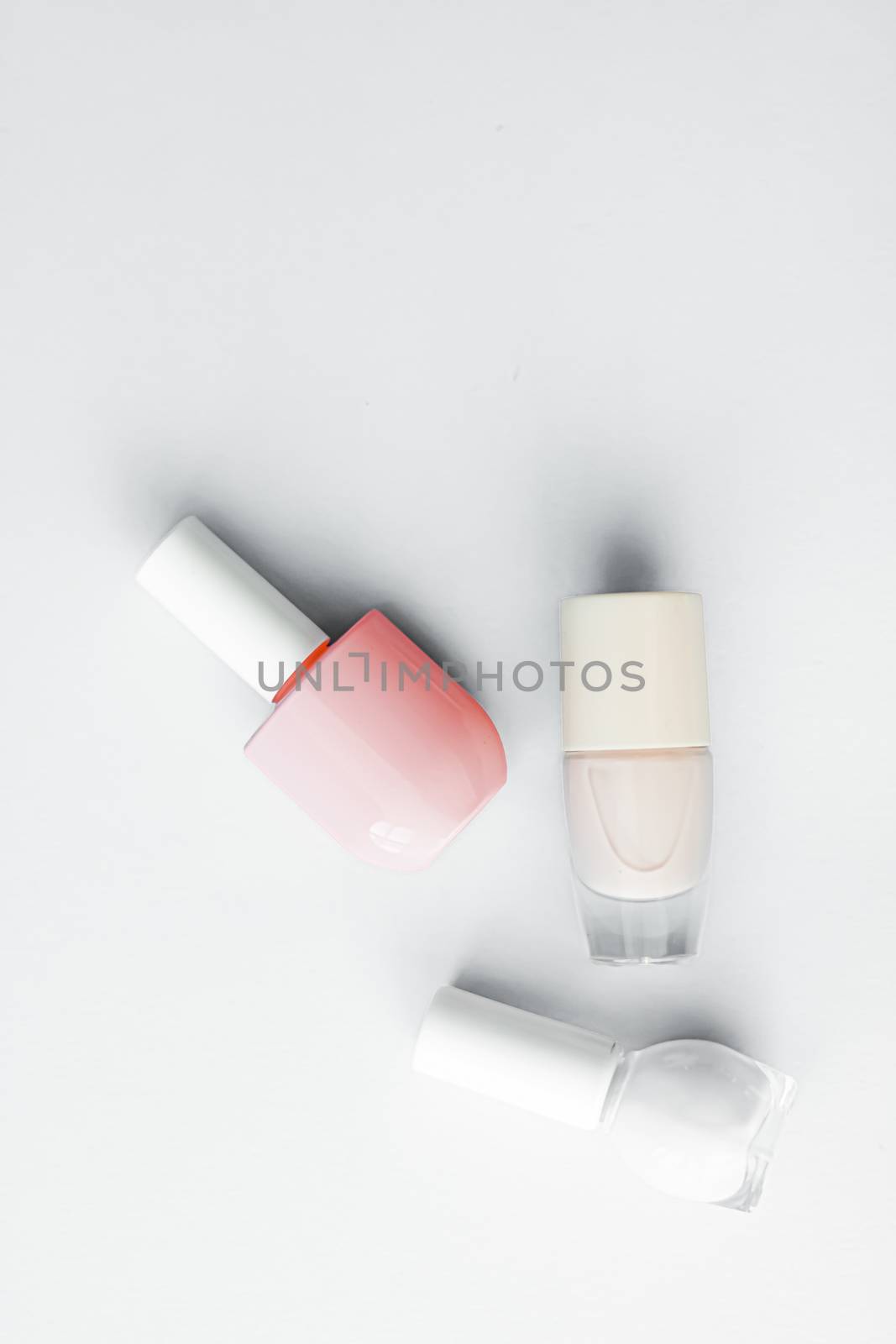 Nail polish bottles on white background, beauty branding