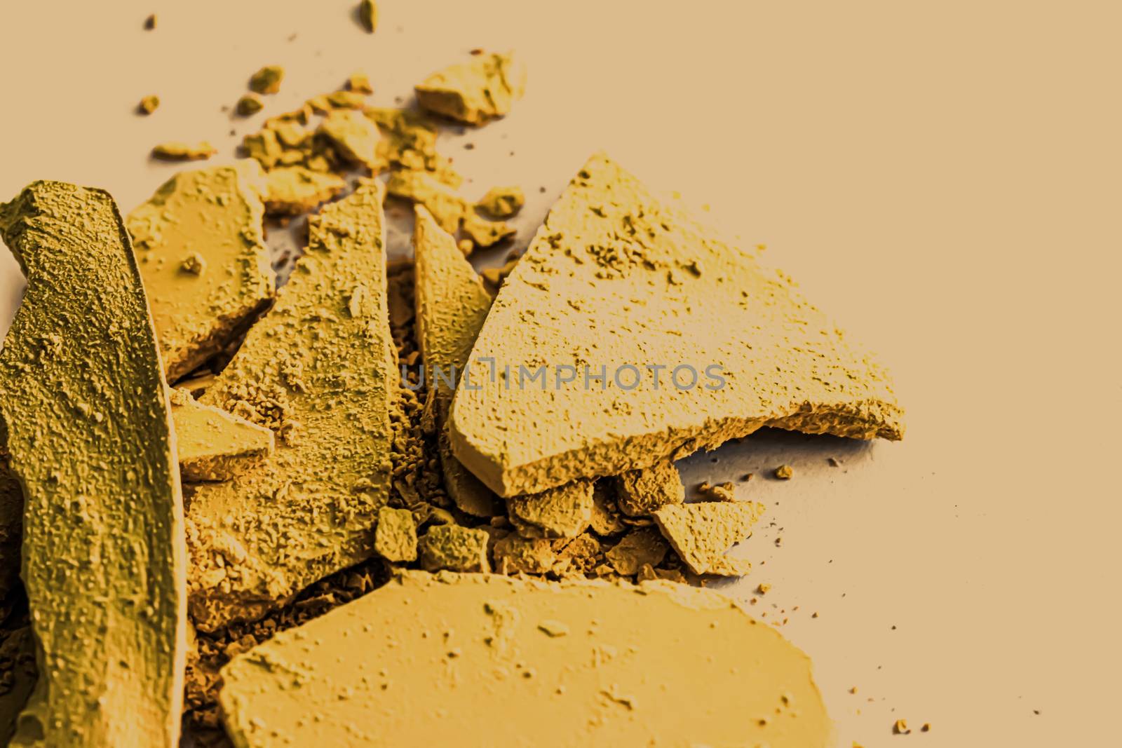 Yellow eye shadow powder as makeup palette closeup, crushed cosm by Anneleven