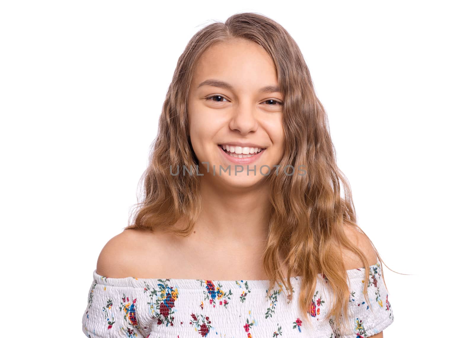 Happy teenage girl laughing looking very happy, isolated on white background