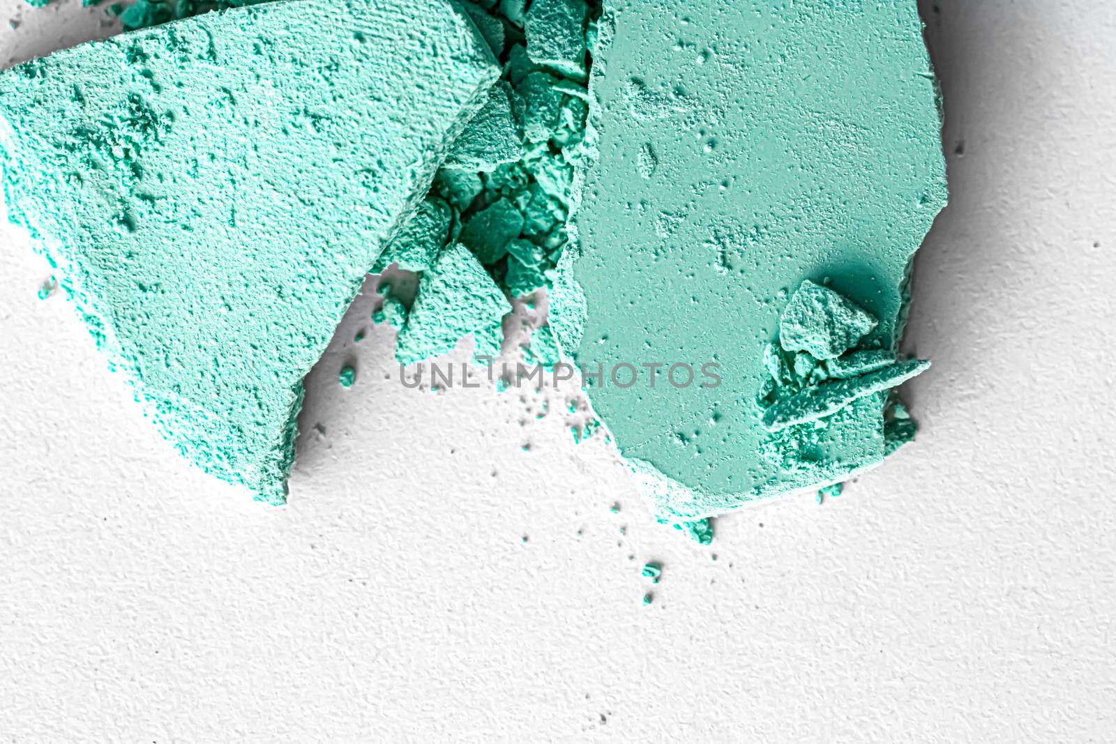 Mint eye shadow powder as makeup palette closeup isolated on white background, crushed cosmetics and beauty textures