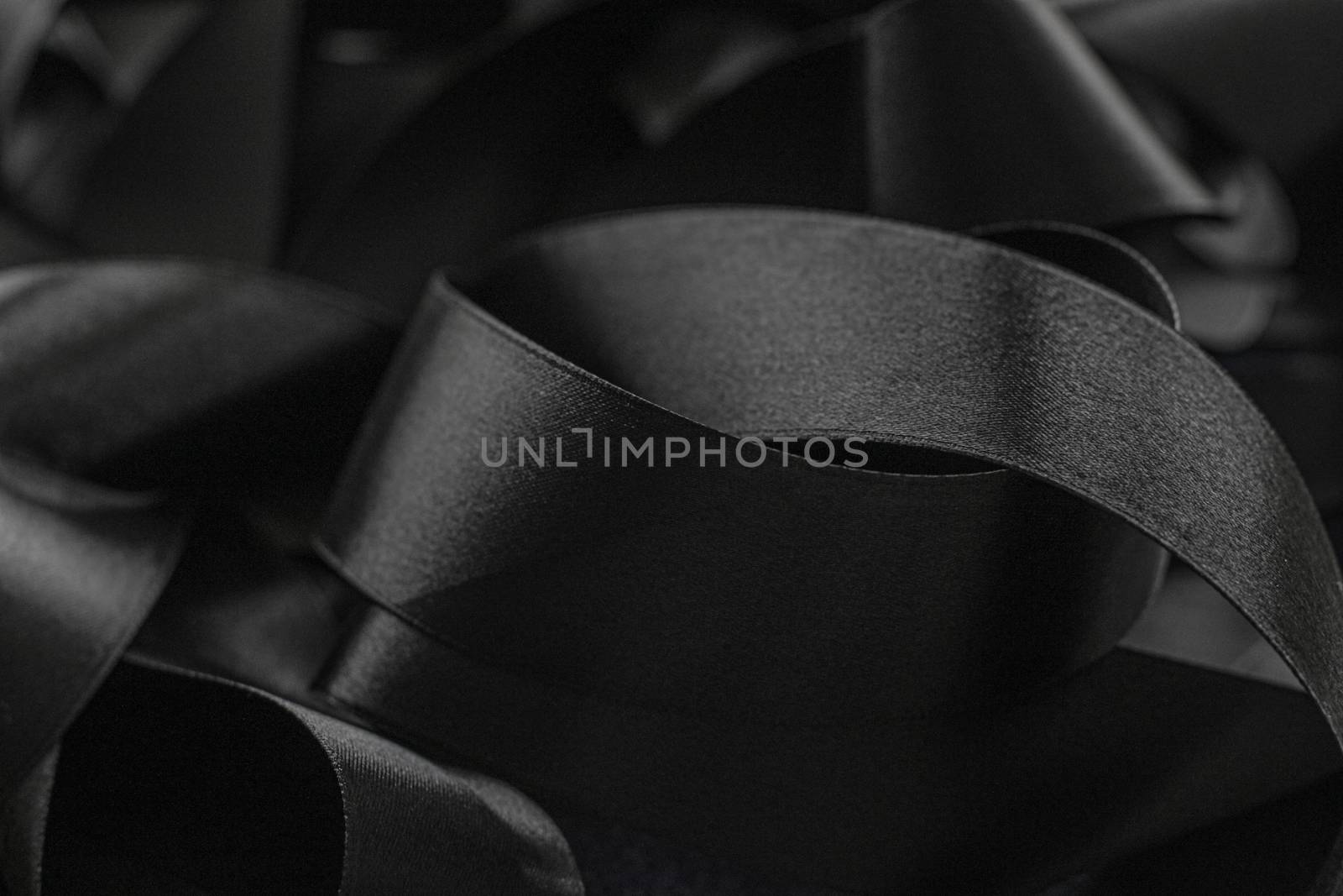 Black silk ribbon as background, abstract and luxury brand designs