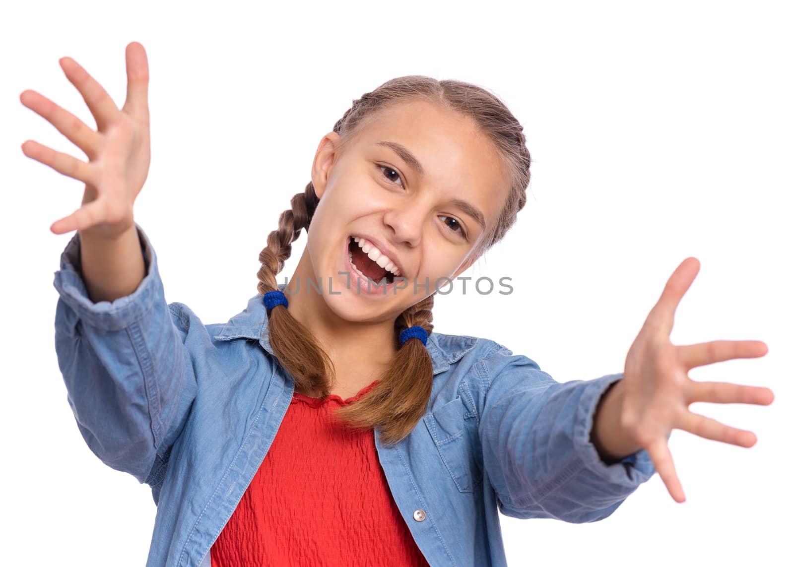 Happy teenage girl laughing looking very happy, isolated on white background