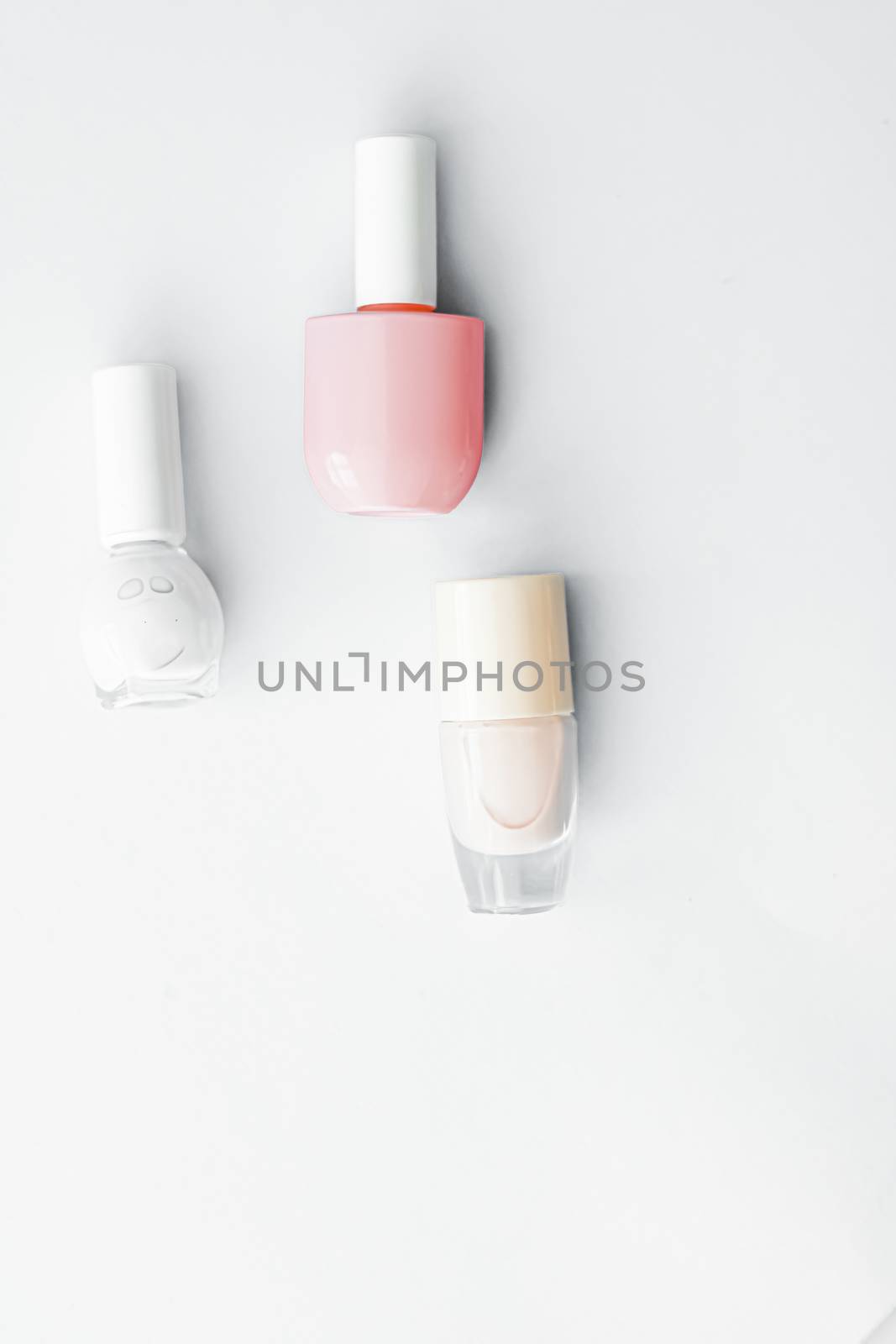 Nail polish bottles on white background, beauty branding