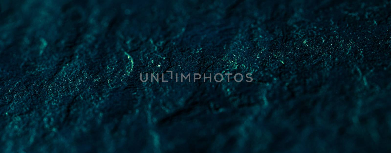 Emerald green stone texture as abstract background, design material and textured surfaces