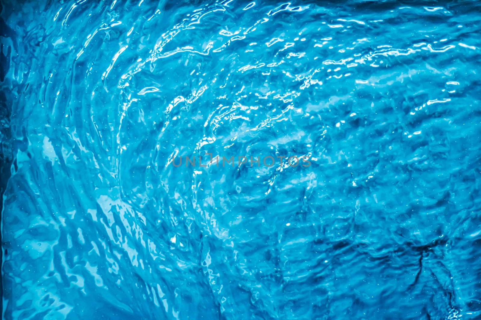 Blue water texture as abstract background, swimming pool and waves designs