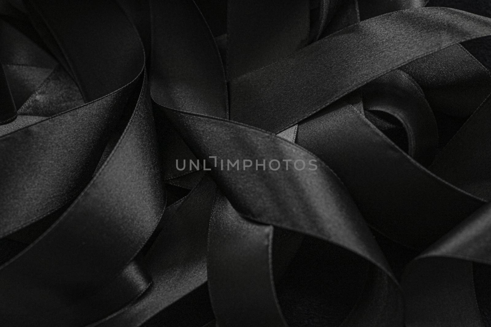 Black silk ribbon as background, abstract and luxury brand designs