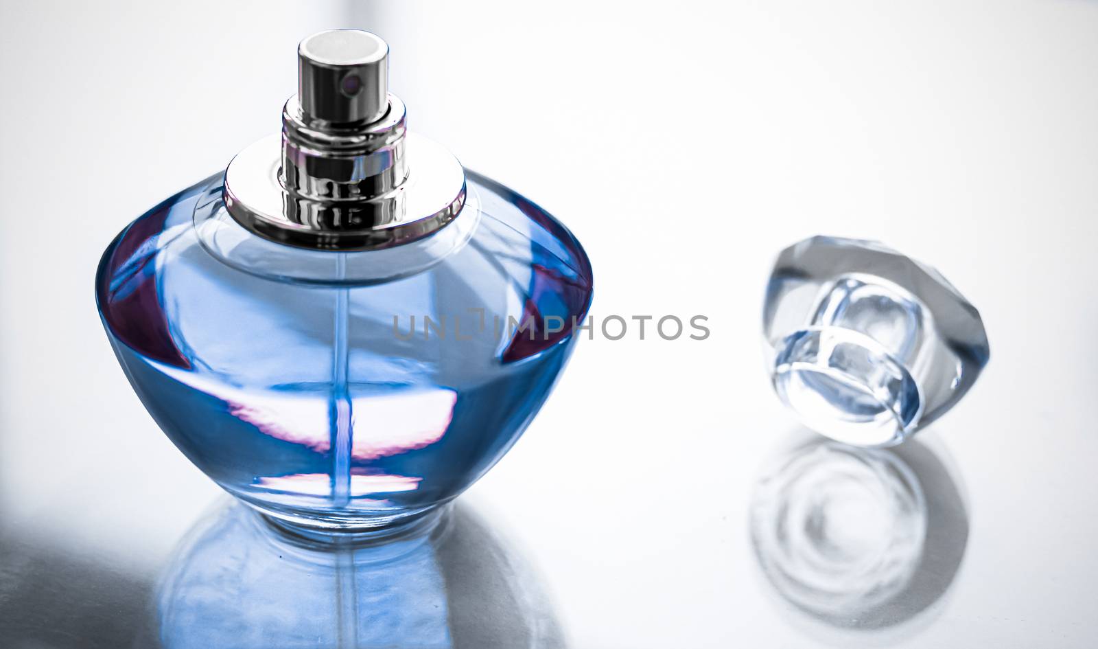 Blue perfume bottle on glossy background, sweet floral scent, gl by Anneleven