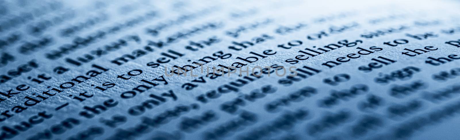 Blue toned macro closeup of an open book, education and studies