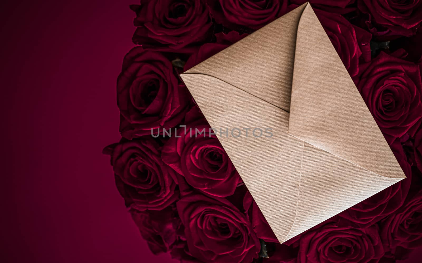 Holidays gift, floral present and happy relationship concept - Love letter and flowers delivery on Valentines Day, luxury bouquet of roses and card on maroon background for romantic holiday design