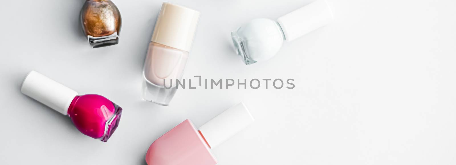 Nail polish bottles on white background, beauty brand by Anneleven