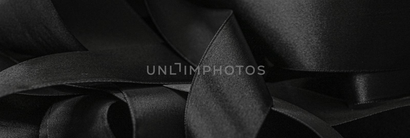 Black silk ribbon as background, abstract and luxury brand desig by Anneleven