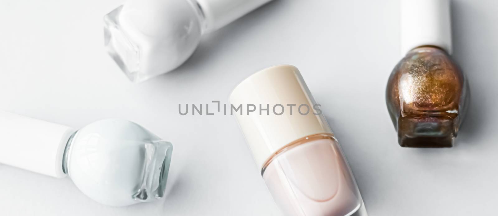 Nail polish bottles on white background, beauty brand by Anneleven