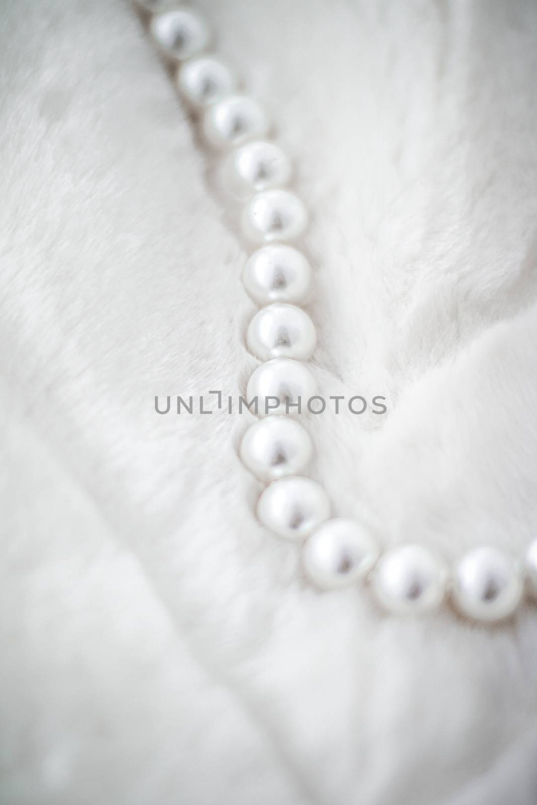 Jewelry branding, elegance and sale concept - Winter holiday jewellery fashion, pearl necklace on fur background, glamour style present and chic gift for luxury jewelery brand shopping, banner design