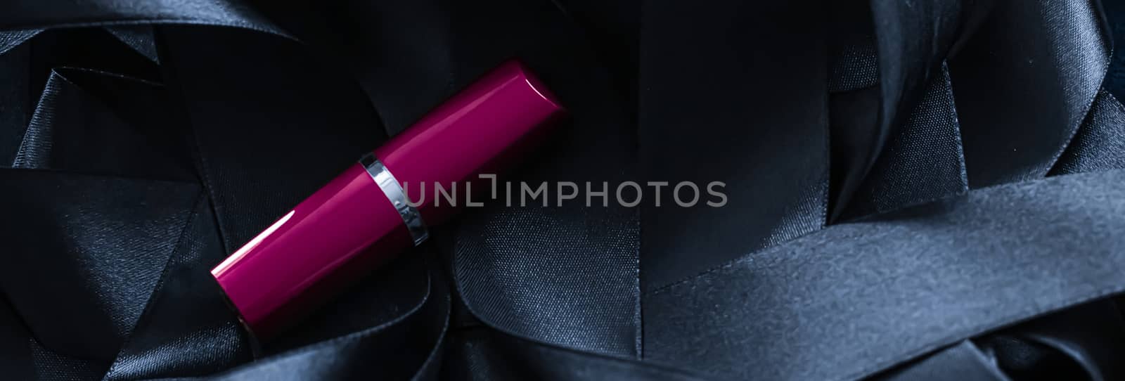 Purple lipstick on black silk background, luxury make-up and bea by Anneleven