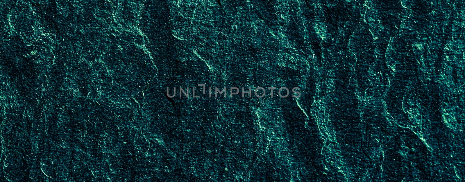 Emerald green stone texture as abstract background, design material and textured surfaces