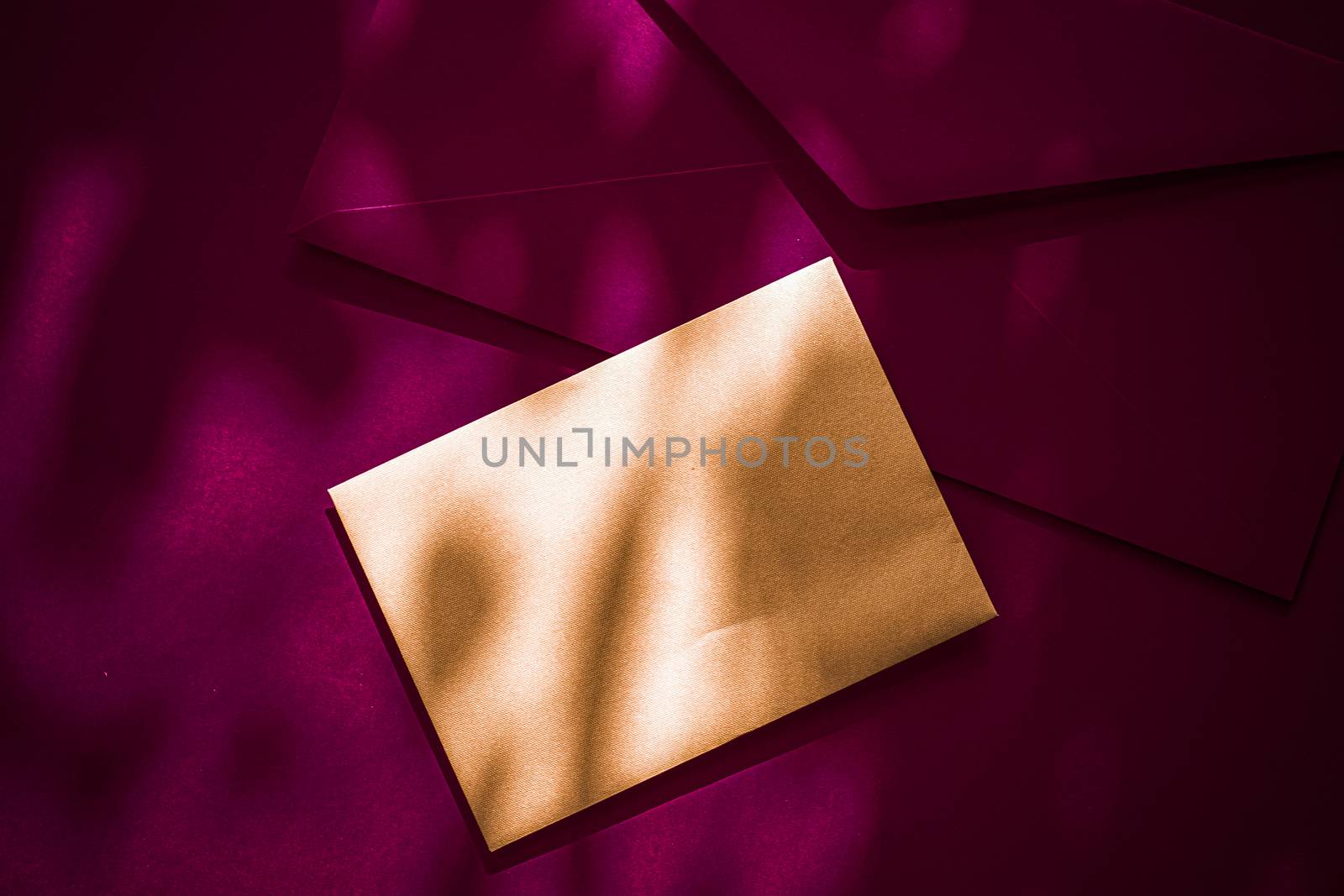 Holiday marketing, business kit and email newsletter concept - Beauty brand identity as flatlay mockup design, business card and letter for online luxury branding on maroon shadow background