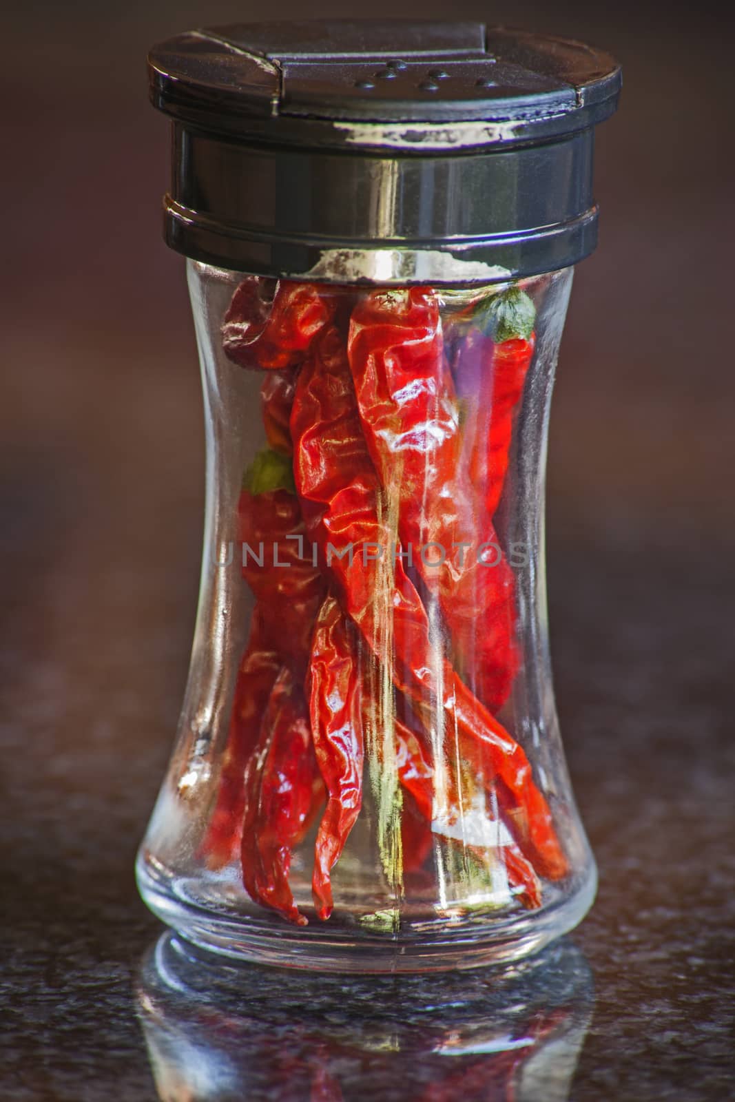 A spice bottle with dried red hot chili 6493 by kobus_peche