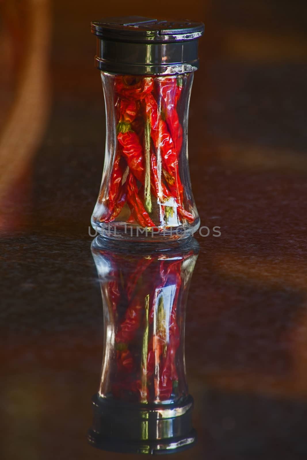 A spice bottle with dried red hot chili 6494 by kobus_peche