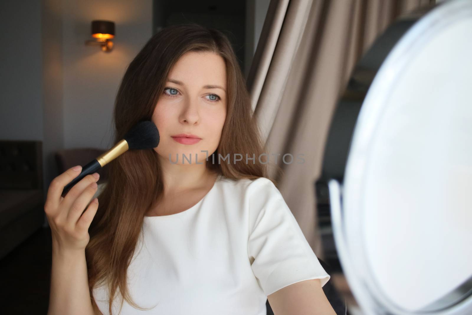 Beauty blogger applying makeup, portrait of beautiful model woma by Anneleven