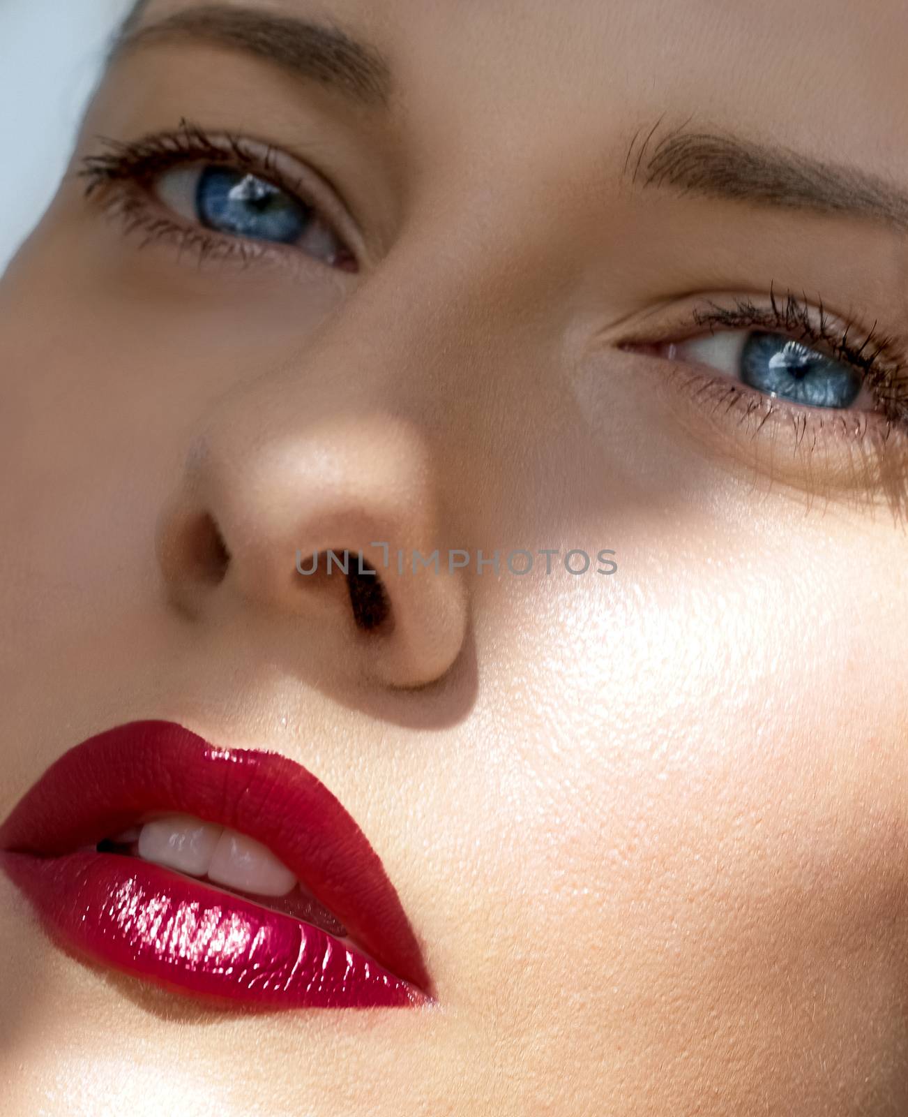 Beauty face closeup, red lipstick makeup look and perfect skin, beautiful model woman portrait