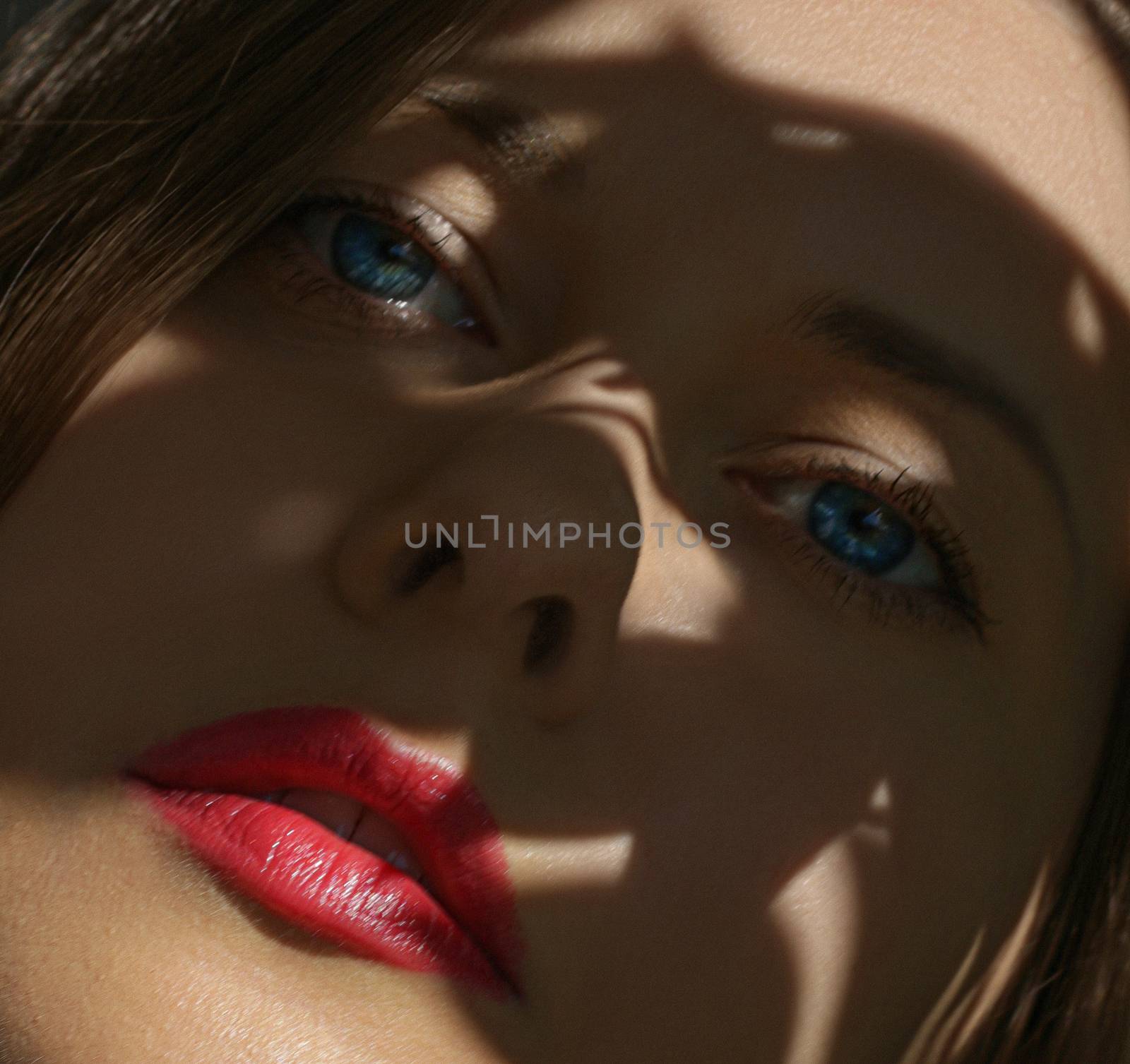 Beauty face closeup, red lipstick makeup look and perfect skin,  by Anneleven