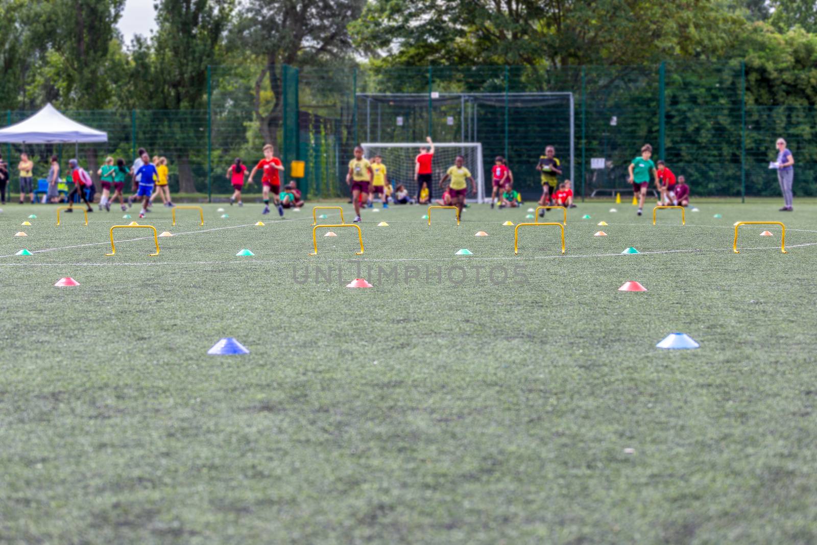 Children competing on school sports day by magicbones