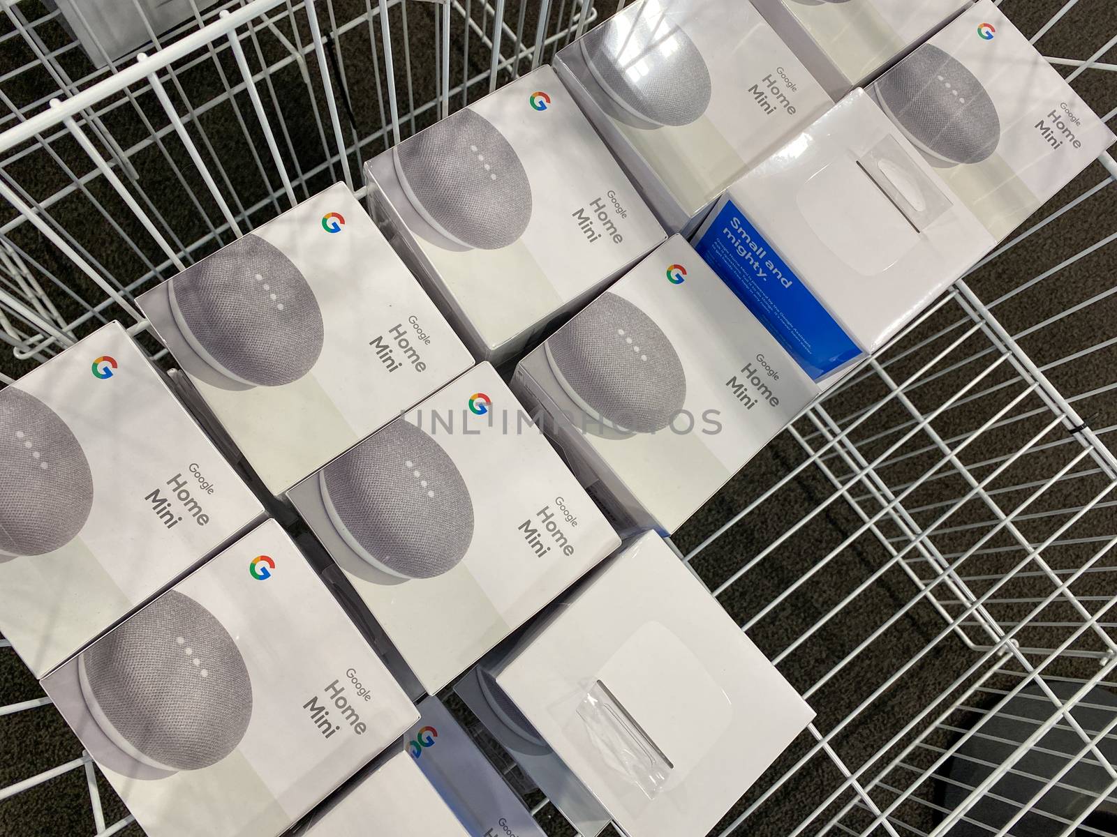 A bin of Google Nest Mini Home devices display at Best Buy in Or by Jshanebutt