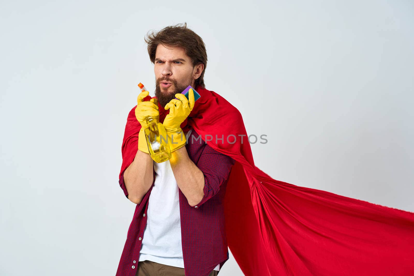 Man in red raincoat rubber gloves cleaning professional homework. High quality photo