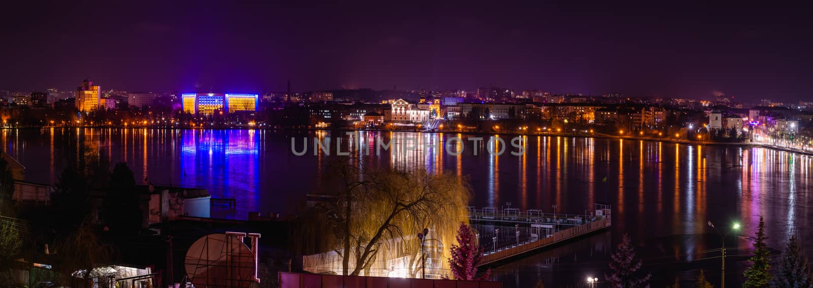 Ternopil, Ukraine 01.05.2020. Panoramic view of Ternopil pond and castle in Ternopol, Ukraine, on a winter night