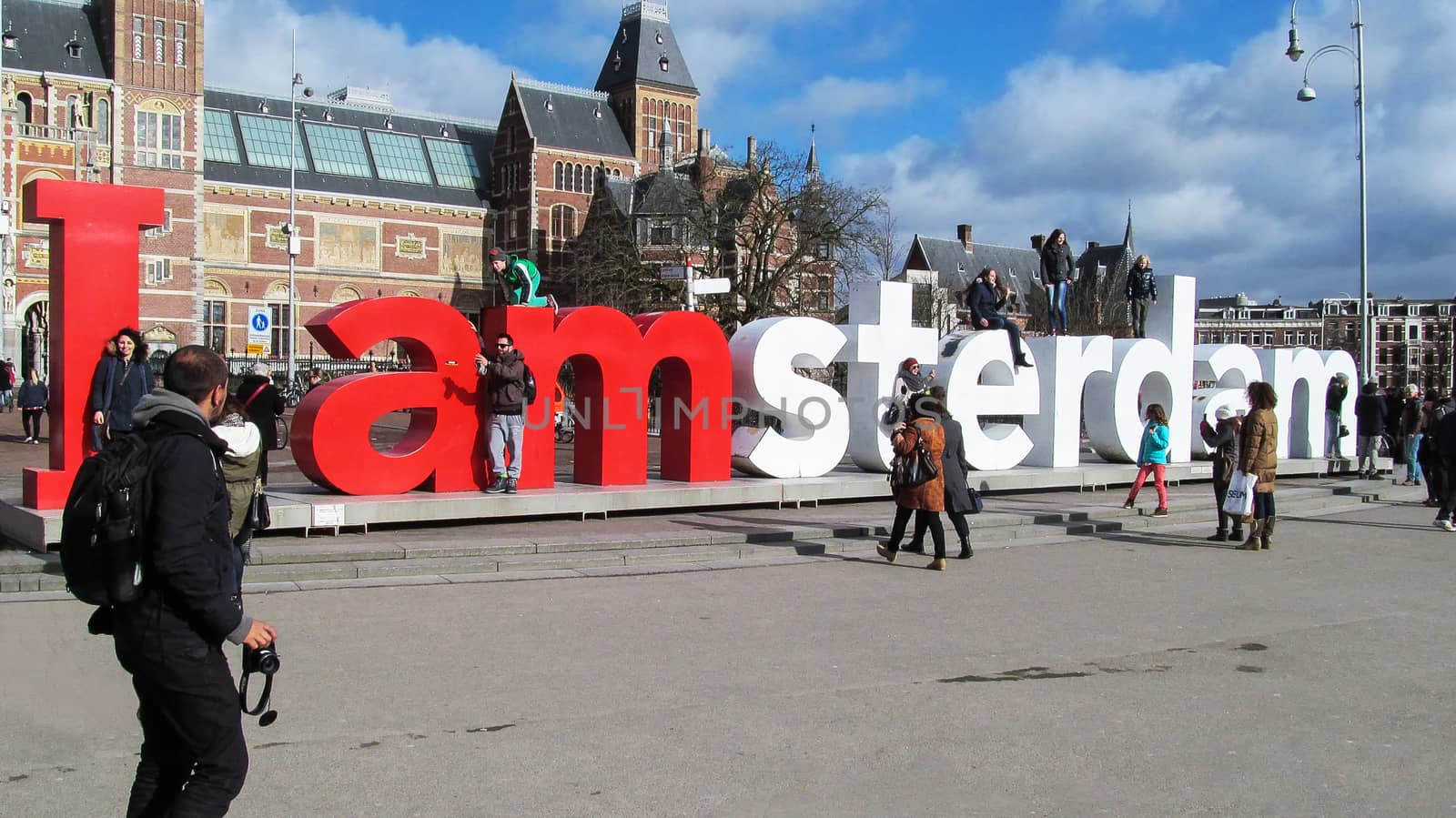 Netherlands, Amsterdam-February 24, 2015: Tourists take pictures near the sculptural composition I Amsterdam