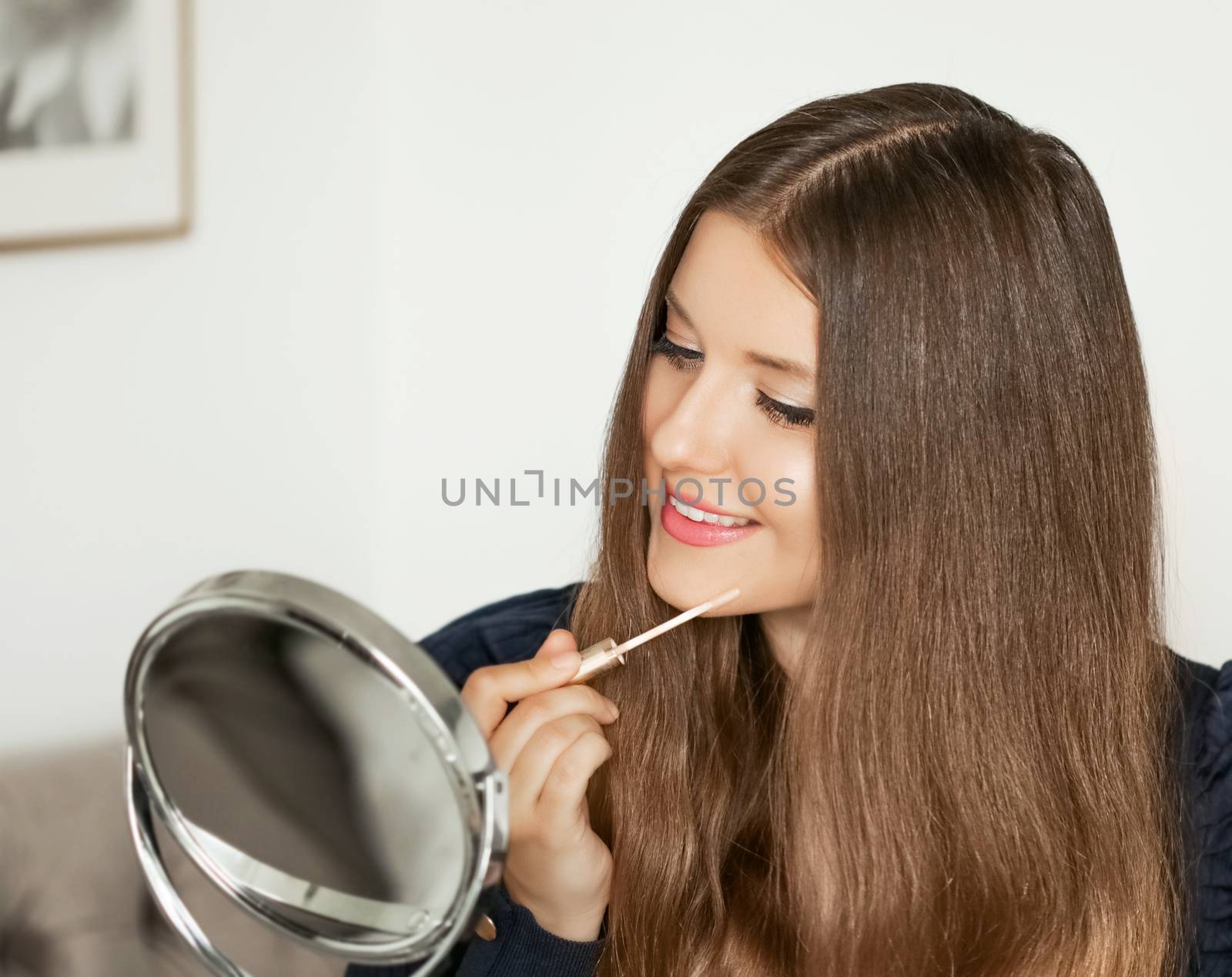 Beauty blogger applying makeup in front of mirror, portrait of beautiful model woman, skincare and cosmetic ad