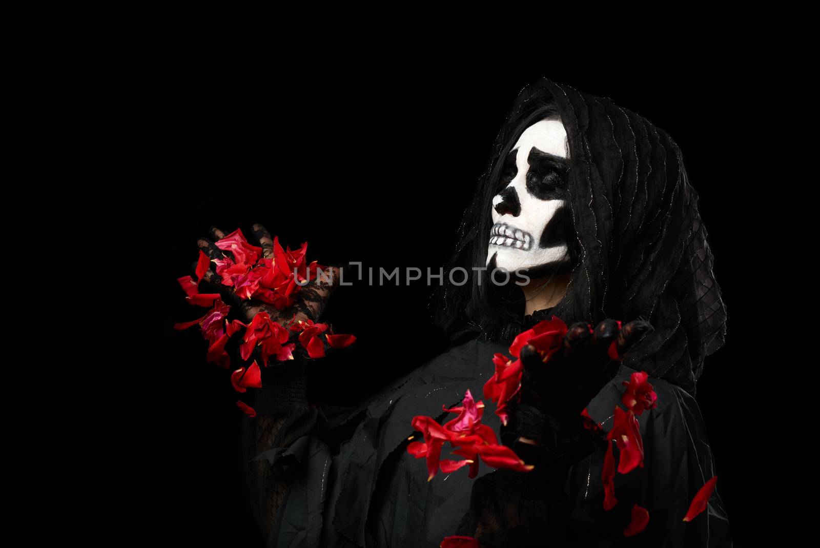 woman in black clothes and skull makeup, black background, carnival Halloween image