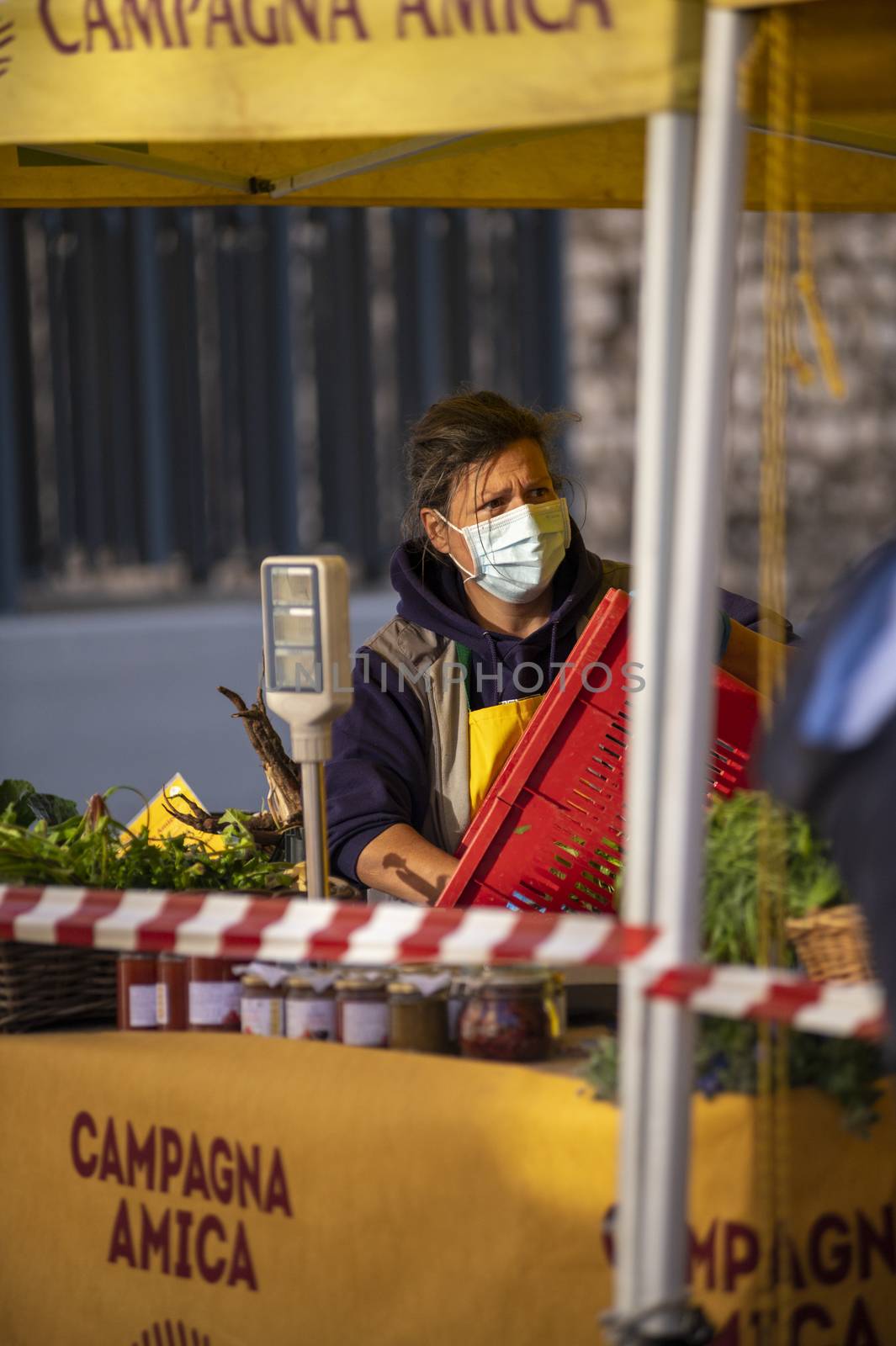 walking woman at market with medical mask by carfedeph