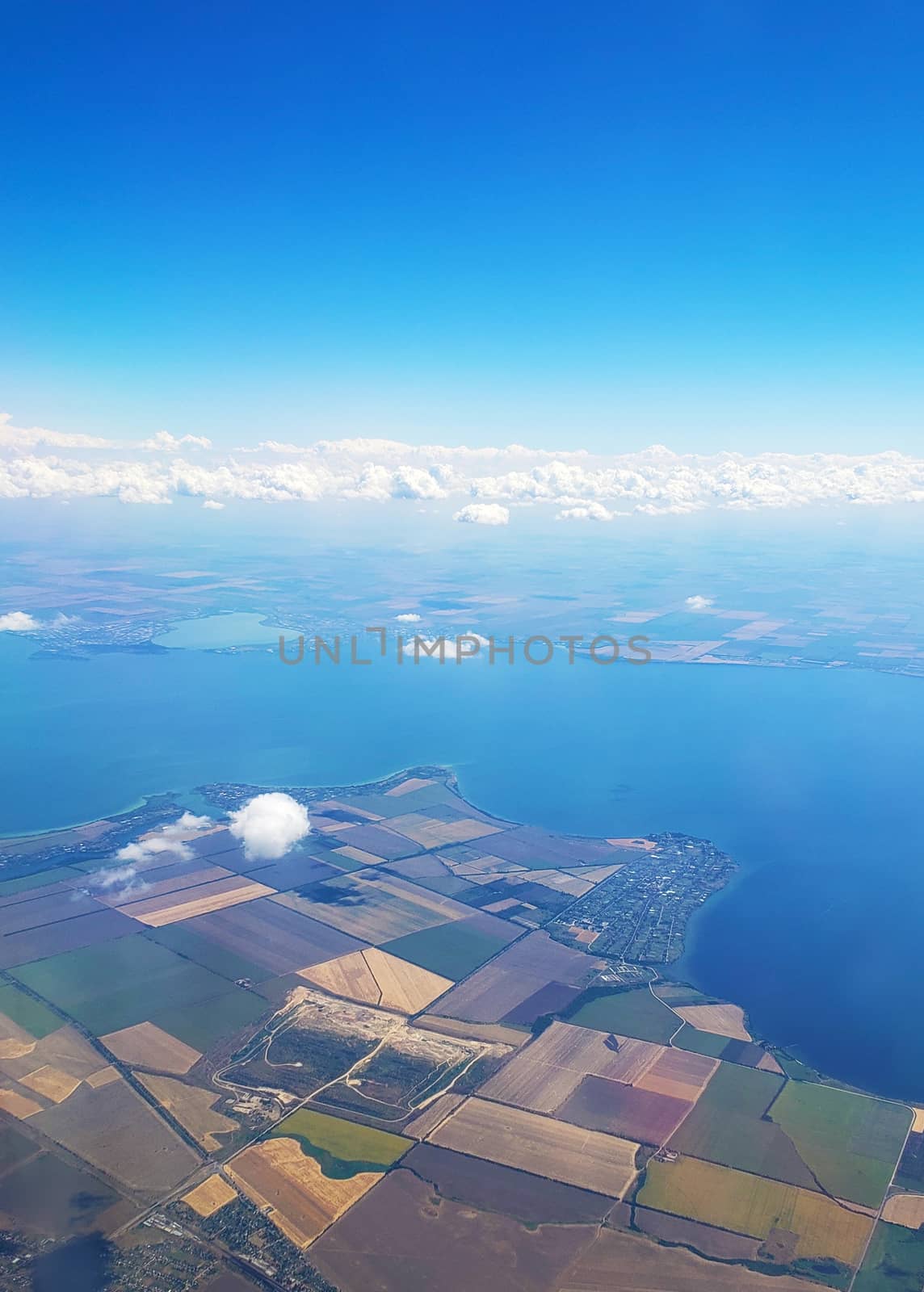 The view from the airplane window to the ground. Landscape view from the sky.