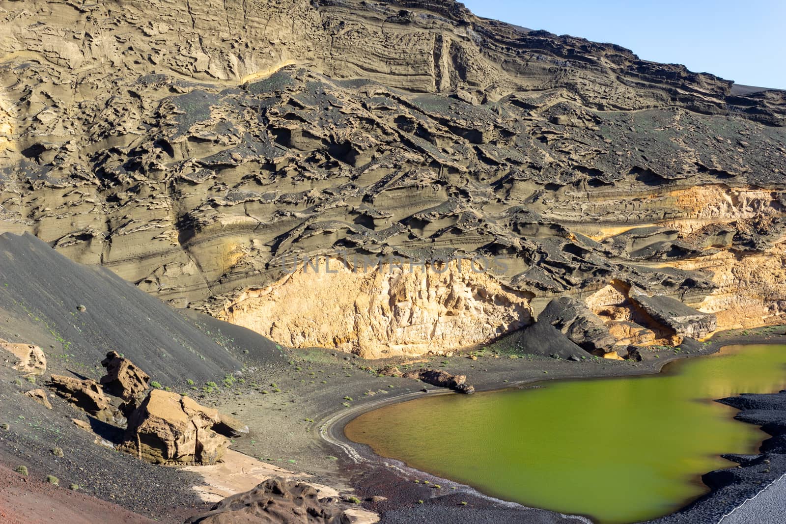 Lagoon with green water (Lago Verde) nearby El Golfo on canary island Lanzarote, Spain