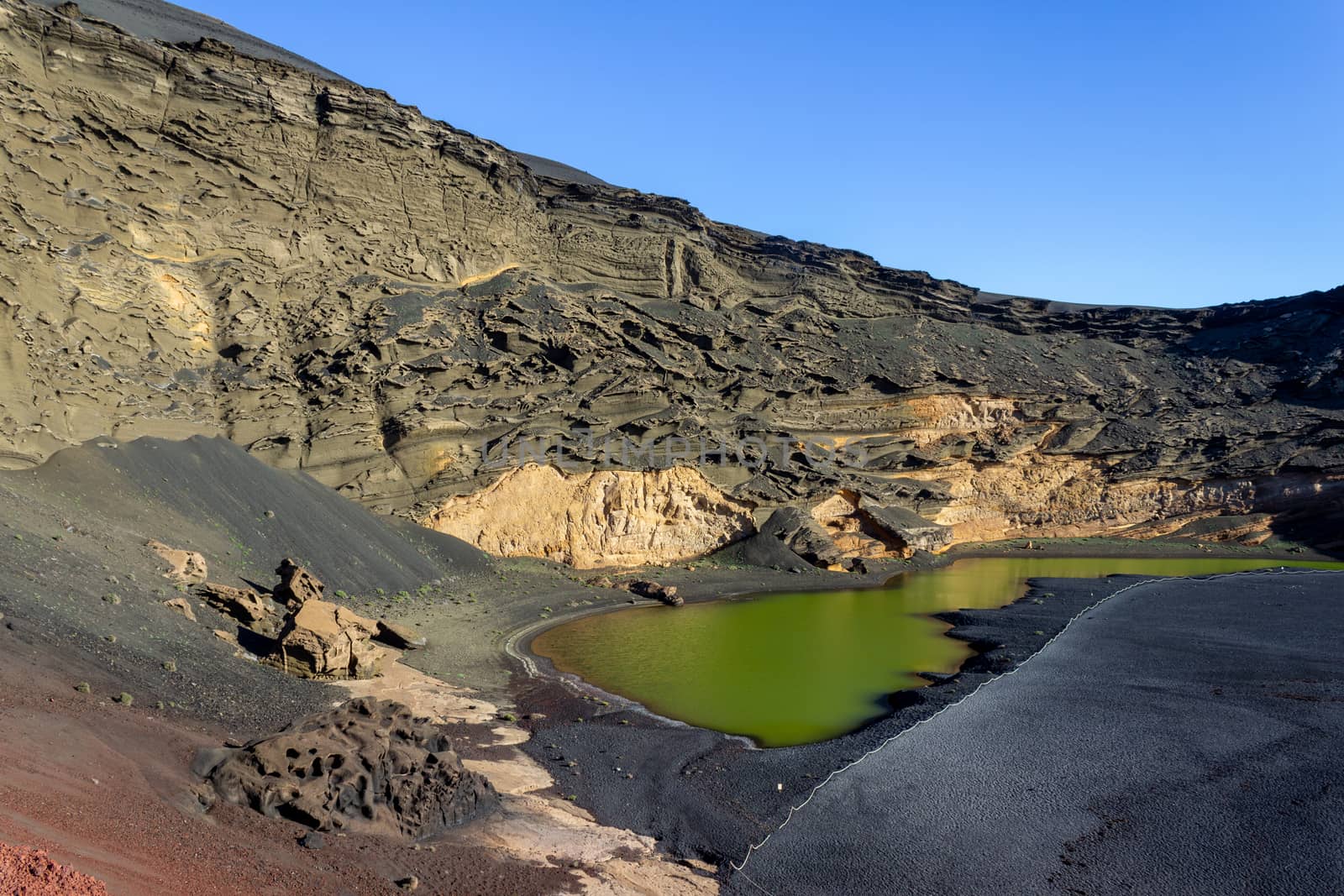 Lagoon with green water (Lago Verde) nearby El Golfo on canary island Lanzarote, Spain