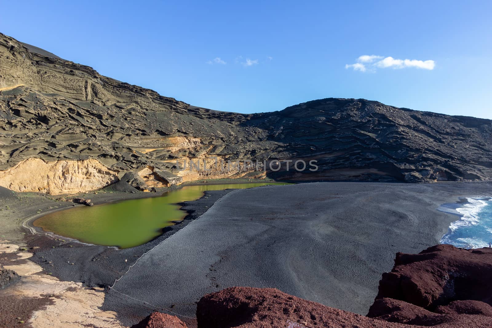 Lagoon with green water (Lago Verde) nearby El Golfo on canary island Lanzarote, Spain