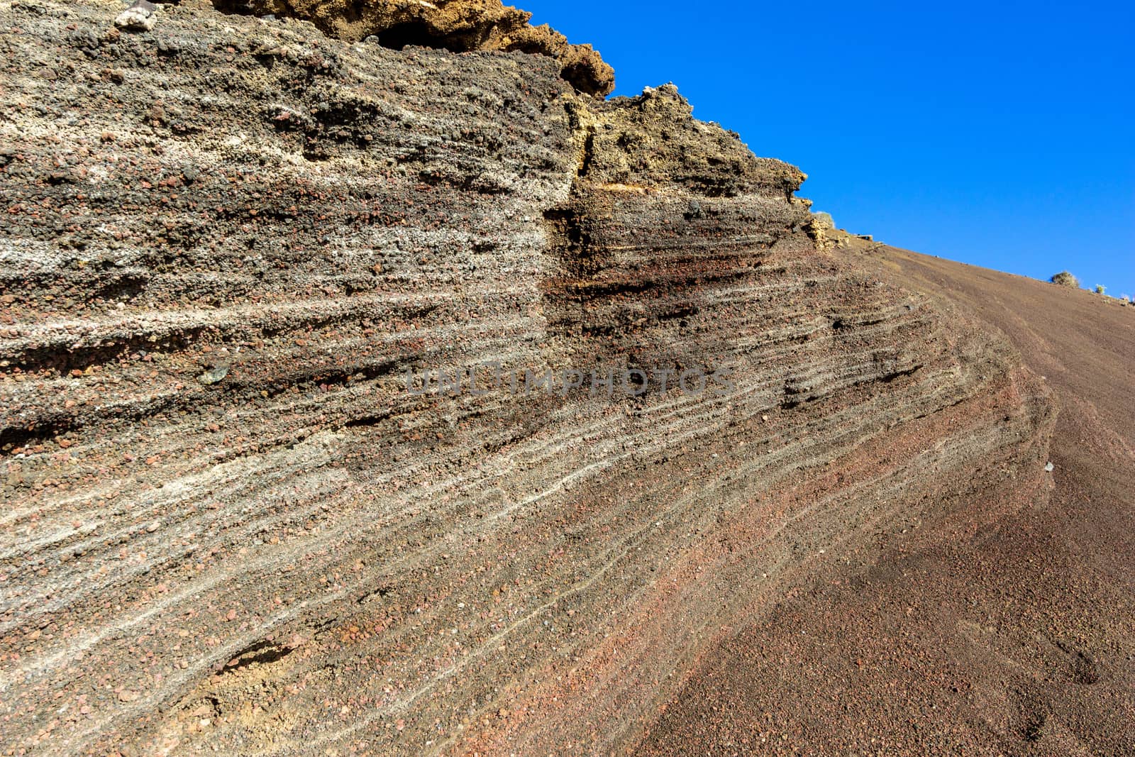 Volcanic rock formation in different colours nearby El Golfo on canary island Lanzarote, Spain