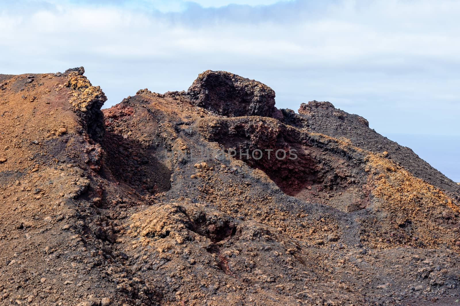 View at multi colored volcanic landscape in Timanfaya Nationalpa by reinerc