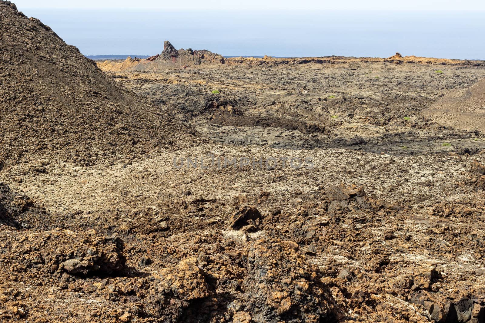 View at multi colored volcanic landscape in Timanfaya Nationalpark on canary island Lanzarote, Spain 