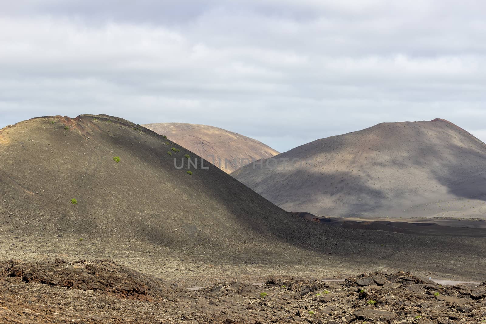 View at multi colored volcanic landscape in Timanfaya Nationalpa by reinerc