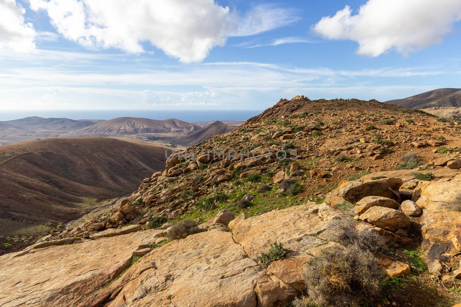 Panoramic view at landscape between Betancuria and Pajara  on Fuerteventura, Spain with multi colored volcanic hills and mountains