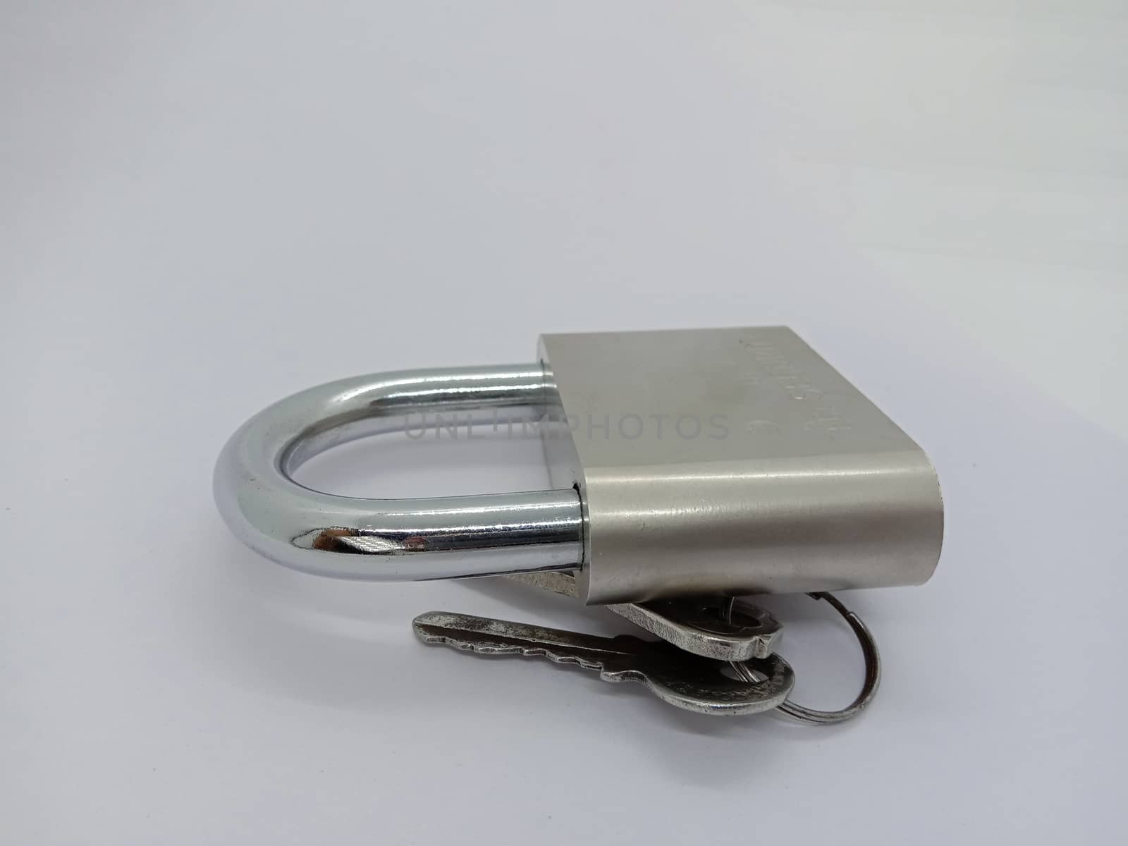 lock and key closeup on gray background