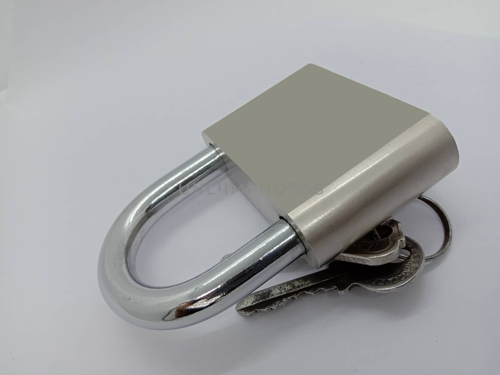 lock and key closeup on gray background