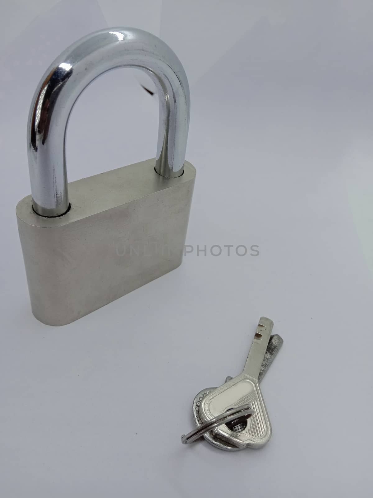 lock and key closeup on gray background