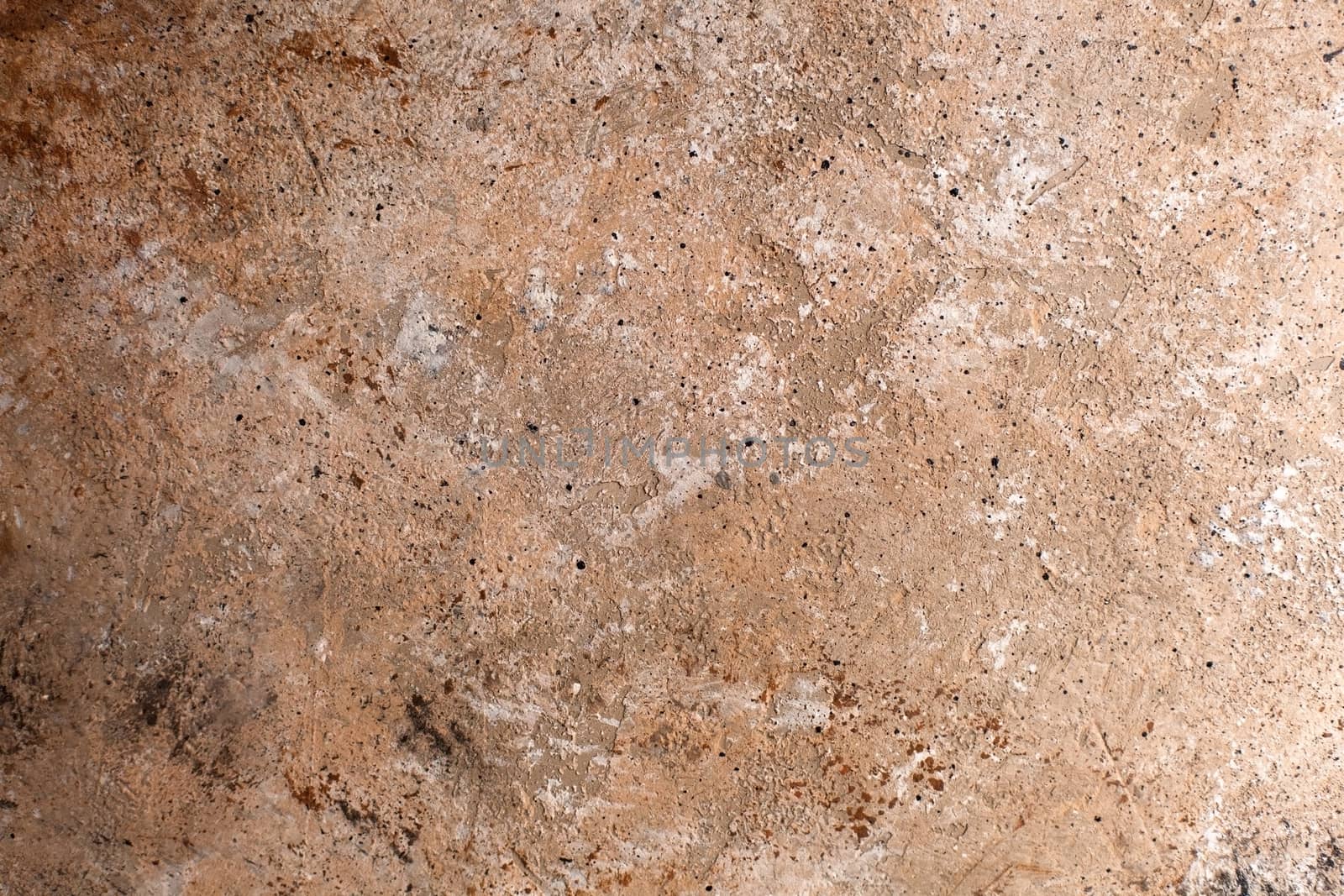 Concrete beige brown black background with scuffs and splashes. Textured wall texture in the grunge style with soft focus. Space for text