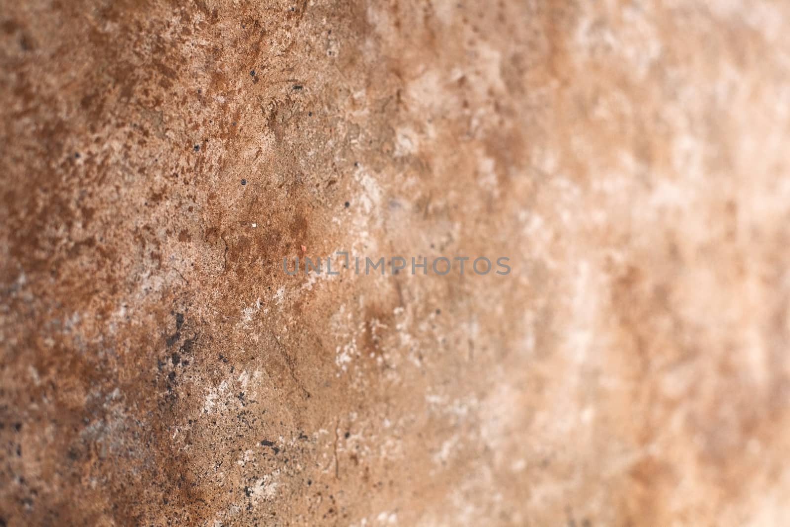 Concrete beige brown black background with scuffs and splashes. Textured wall texture in the grunge style with soft focus. Space for text